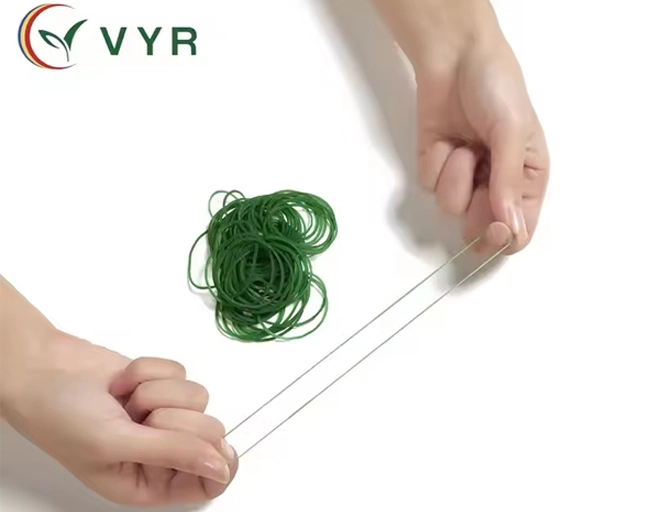 Close-up view of green elastic rubber bands for packaging applications